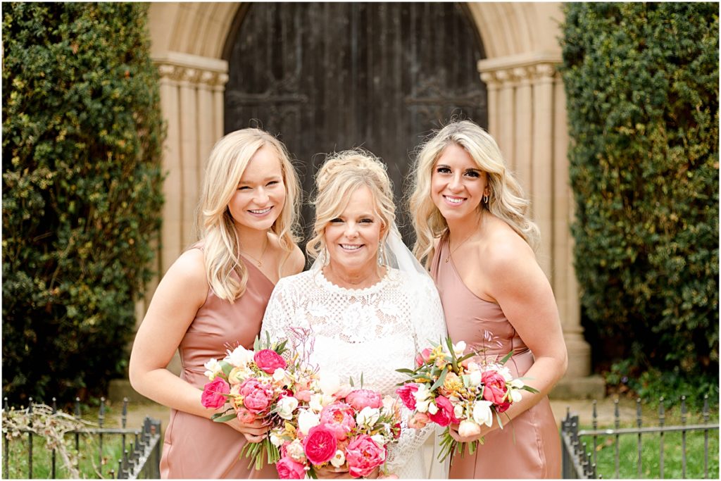 Wedding Photographer in Arkansas captured this image of bride with two bridesmaids