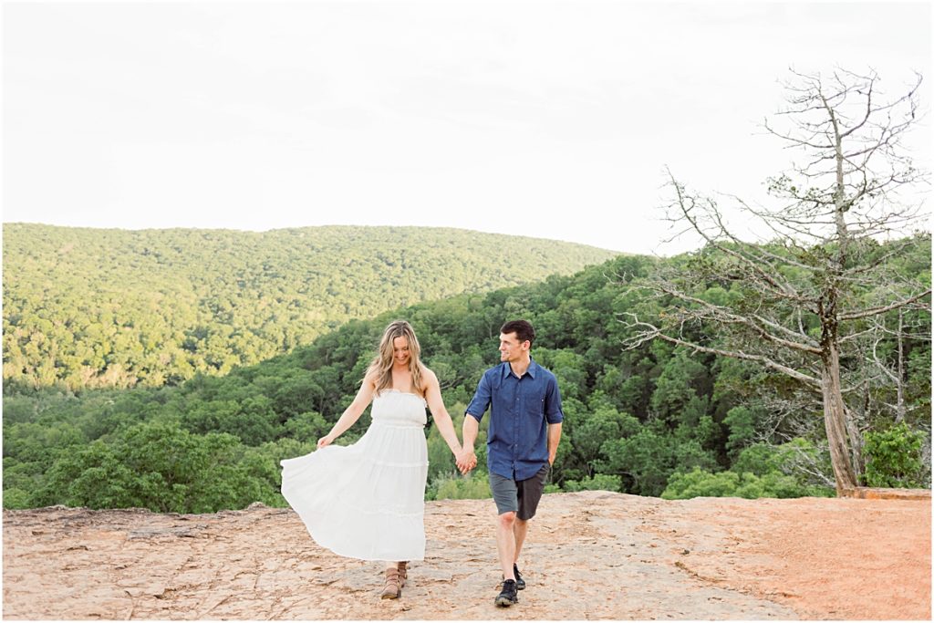 Sarah and Jarod walking along Yellow Rock Trail during their engagement session with an Arkansas photographer.