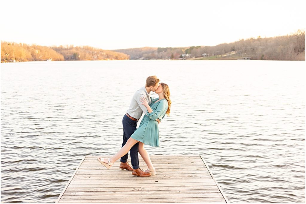 Craig and Jillian kissing on a dock during Bella Vista Engagement