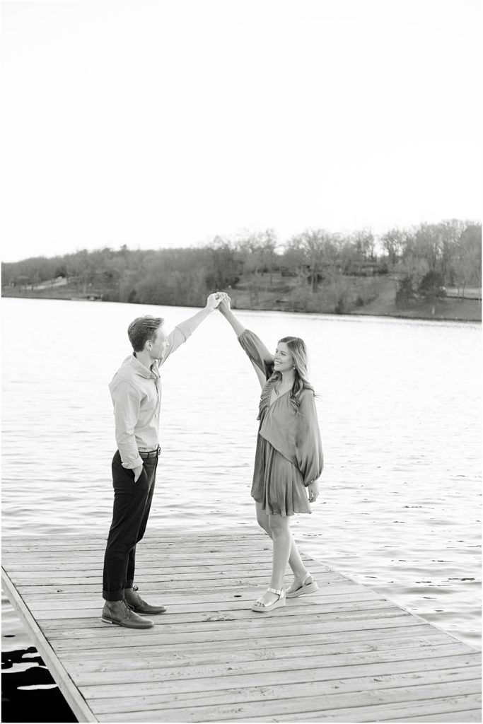 Jillian and Craig dancing on a dock during Bella Vista Engagement