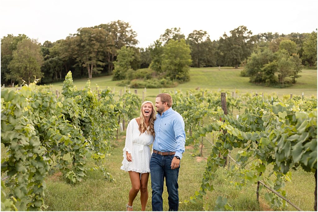 Remington and Jackson laughing in the vineyard rows during a Springdale AR Engagement session 
