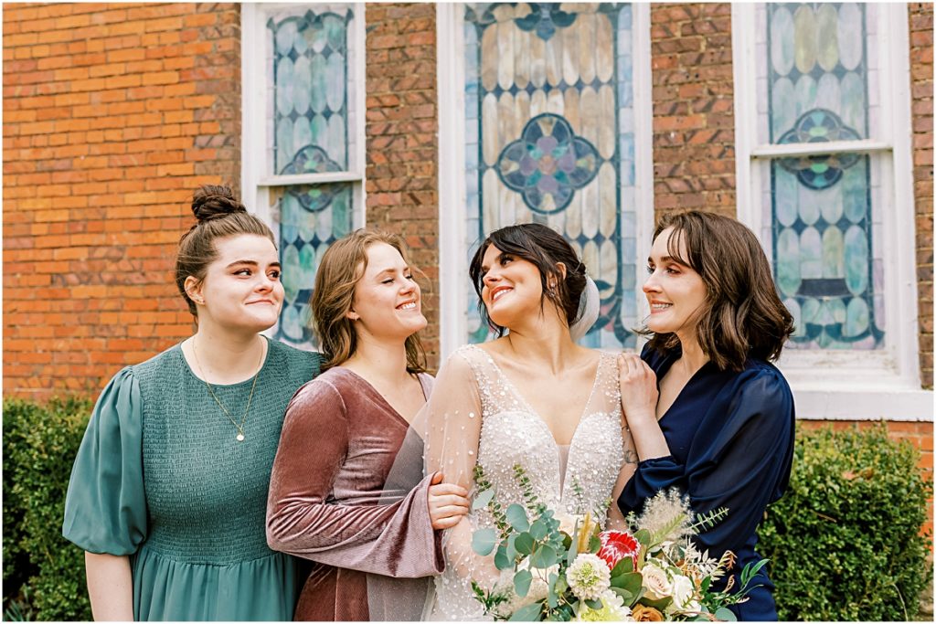 Emily with bridesmaids/family outside church during Arkansas Elopement 