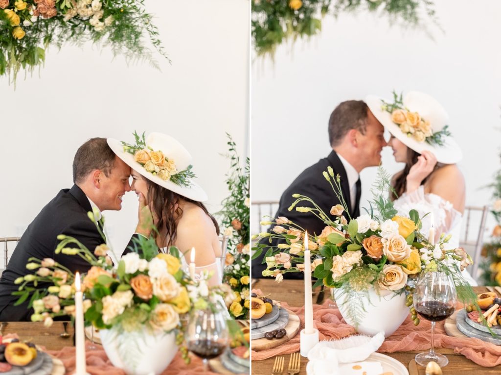 A look at the happy couple on their wedding day behind floral designs by Flora Leigh.
