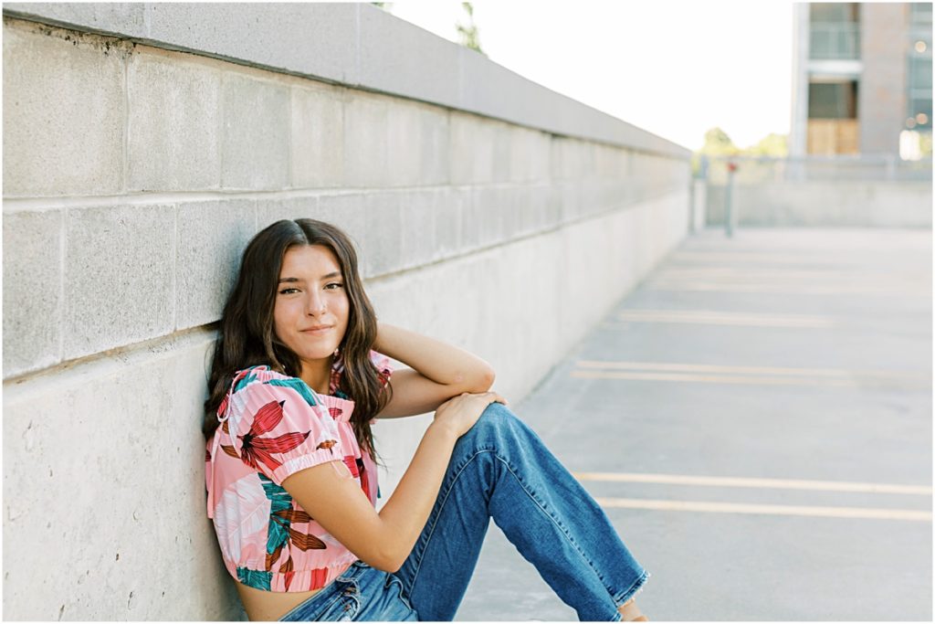 Madison leaning against a wall 
